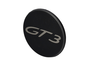 Stemma 'GT3' sul tappo della serratura della ruota centrale, in nero opaco. Porsche 991 GT3 - 9P1601349EOK1, 99136120790